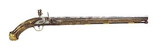 A Persian Silver Overlaid and Brass Inlaid Long-Barrel Flintlock Pistol Length 28 inches.