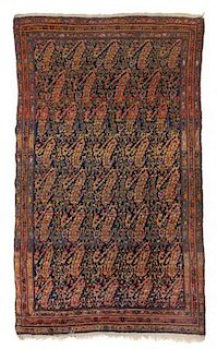 * A Persian Wool Rug 6 feet 5 inches x 4 feet 2 inches.