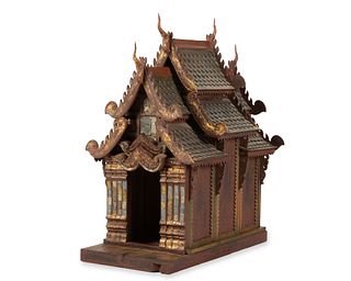 A large Thai carved wood spirit house