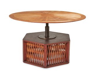 A custom teak adjustable table