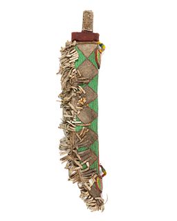 A Nigerian sword with beaded scabbard