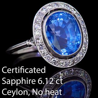 IMPORTANT 6.12 CT. CEYLON BLUE SAPPHIRE AND DIAMOND CLUSTER RING