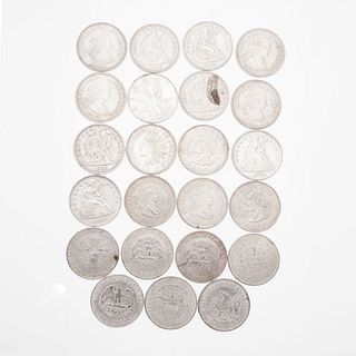 Veintitrés monedas de plata ley .500 y Cuproníquel. Peso: 567.2 g.