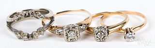 Four 14K gold and diamond rings