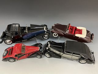 Four Franklin Mint Die Cast Cars