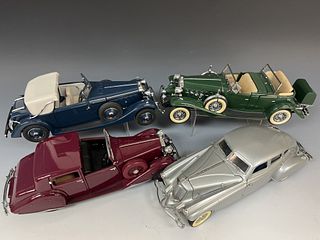 Four Danbury Mint Die Cast Cars