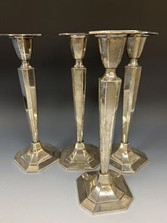 Four Silver Candlesticks