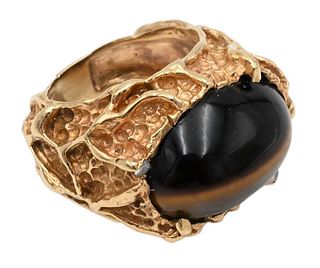 14 Karat Gold Ring, set with oval cabochon tiger eye, with two small diamonds, size 6, 17.2 grams.