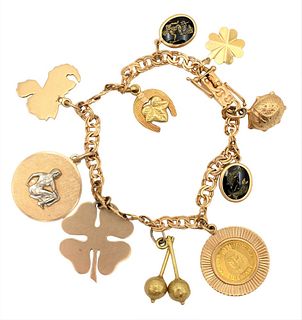 18K G.D. & Co. Bracelet with Charms, set with four 14K gold charms and Venezuelan gold coin, 31.5 grams.