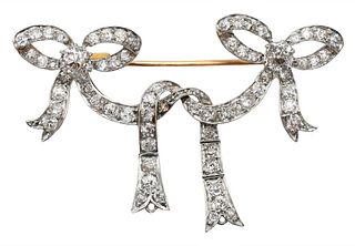 Diamond and Gold Brooch, double bow design, set with diamonds, two largest approximately .35 carats each, numbered 1424, 8.4 grams.