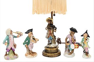 Four Piece Porcelain Monkey Band, one marked with crossed swords, height 5 inches; along with a porcelain monkey band lamp.