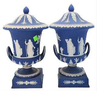 Pair of Wedgwood Blue Jasperware Covered Urns, with handles, height 12 inches.
