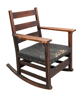Gustav Stickley Oak Rocking Chair, having Gustav Stickley brand marking, height 32 inches, width 25 inches.