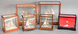 Six Piece Lot, to include five sterling silver sailing boats marked Sterling 960, along with crane and turtle; all in glass cases; heights 7 1/2 - 12 