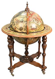 Celestial Globe, set on wood base ending in brass casters, having fitted interior (no inserts), height 40 inches, diameter 26 inches. Provenance: Wate