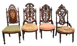 Four Victorian Walnut Side Chairs, all with pierce carved backs.