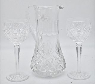 Group of Assorted Glasses, to include set of 12 tall Waterford stems, Steuben candlestick, a pitcher, along with 2 William Yeoward pieces.