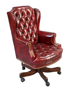 Schaefer Maroon Leather Executive Swivel Chair, having tufted back and seat, (back has two imperfections on edges), height 43 inches.