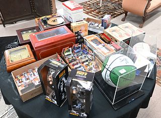 Table Lot, to include Lionel cars, Matchbox cars, six music boxes, early 2000's signed Celtics basketball including Paul Pierre signature, miscellaneo