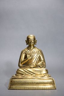 Ming: A Gilt Bronze Seated Enlightened Monk Statue