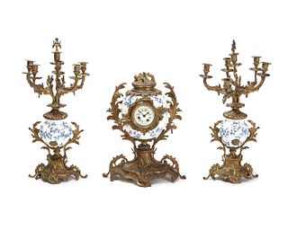 A Continental gilt-spelter and porcelain clock set