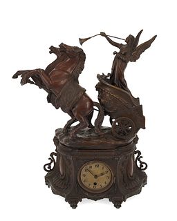 A spelter figural mantle clock