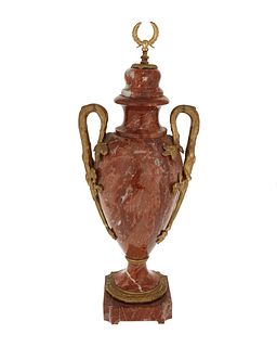 A Louis XVI-style rouge marble urn