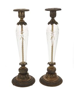 A pair of cut crystal and bronze candlesticks