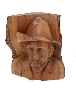 A Swiss carved wood portrait of a man