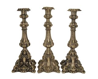 Three Continental silver candlesticks