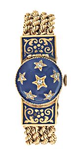 A lady's 14 karat gold and enamel wrist watch with integral bracelet