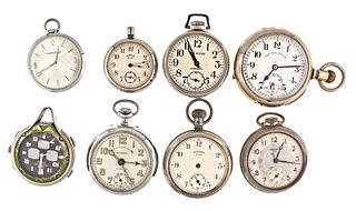 A lot of twenty five pocket watches and a travel clock