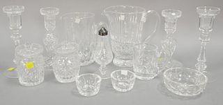 Waterford crystal thirteen piece lot with two pitchers and two pair candlesticks. ht. 1 1/2 in. to 8 in.