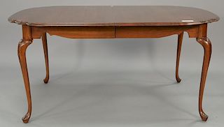 Harden cherry shaped dining table with two 16" leaves and custom pads. closed: 64" x 44", open: 96" x 44"