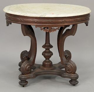 Oval Victorian marble top table. ht. 30 in.; top: 36" x 35 1/2"