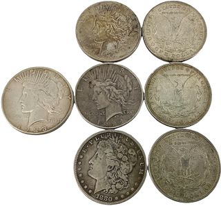 Seven U.S. Silver Dollar Coins