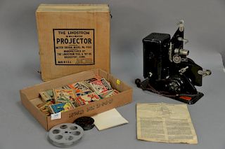 Lindstrom 16mm projector with four films Mickey Mouse, two Popeye, and Krazy Kat.