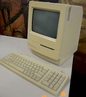 Two Macintosh Apple classic computers, model #m0420.