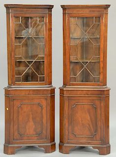 Pair of mahogany corner cabinets. ht. 72 in.; wd. 25 1/2 in.; dp. 15 in.