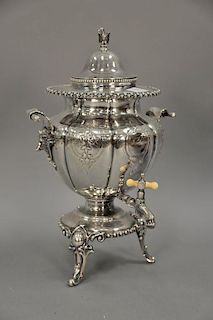 Silverplate hot water urn with boars heads.
