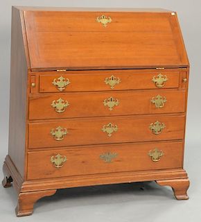 Chippendale cherry desk having slant front over four drawers set on ogee feet, 18th century. ht. 45 1/2 in.; wd. 39 1/2 in.