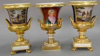 Three French porcelain urns. ht. 10 in.