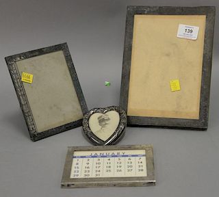 Four sterling silver frames, two are marked Tiffany & Co.