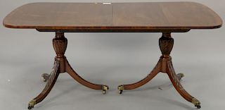 Kittinger mahogany banded inlay double pedestal dining table with one 18" leaf. 68" x 44"