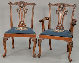 Set of eight mahogany dining chairs with Louis XV style legs and needlepoint seats.