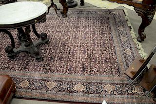 Oriental style machine made rug. 8'2" x 11'7".