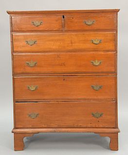 Primitive pine lift top blanket chest having two over two false drawer top over two drawers. ht. 50 in.; wd. 38 in.