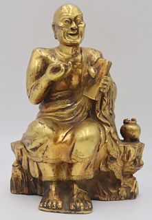 Asian Gilt Bronze Seated Figure of a Monk.