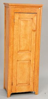 Primitive cupboard, narrow with one door with raised panels and surround molding, now repainted with grain paint, late 18th to early...