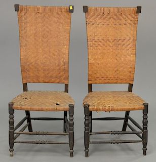 Two caned side chairs.